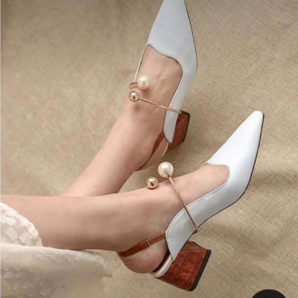 White leather block heel sling backs.